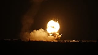 Flames are seen following an Israeli air strike in the town of Khan Yunis, in the southern Gaza Strip, early on November 22, 2020. 