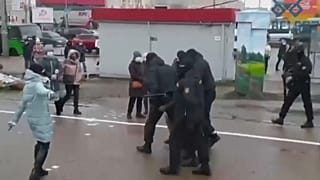 Protesters being led away by police