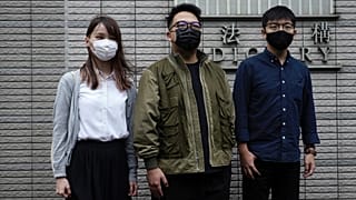 Hong Kong activists, from right, Joshua Wong, Ivan Lam and Agnes Chow at a court in Hong Kong, Monday, Nov. 22. 2020. 