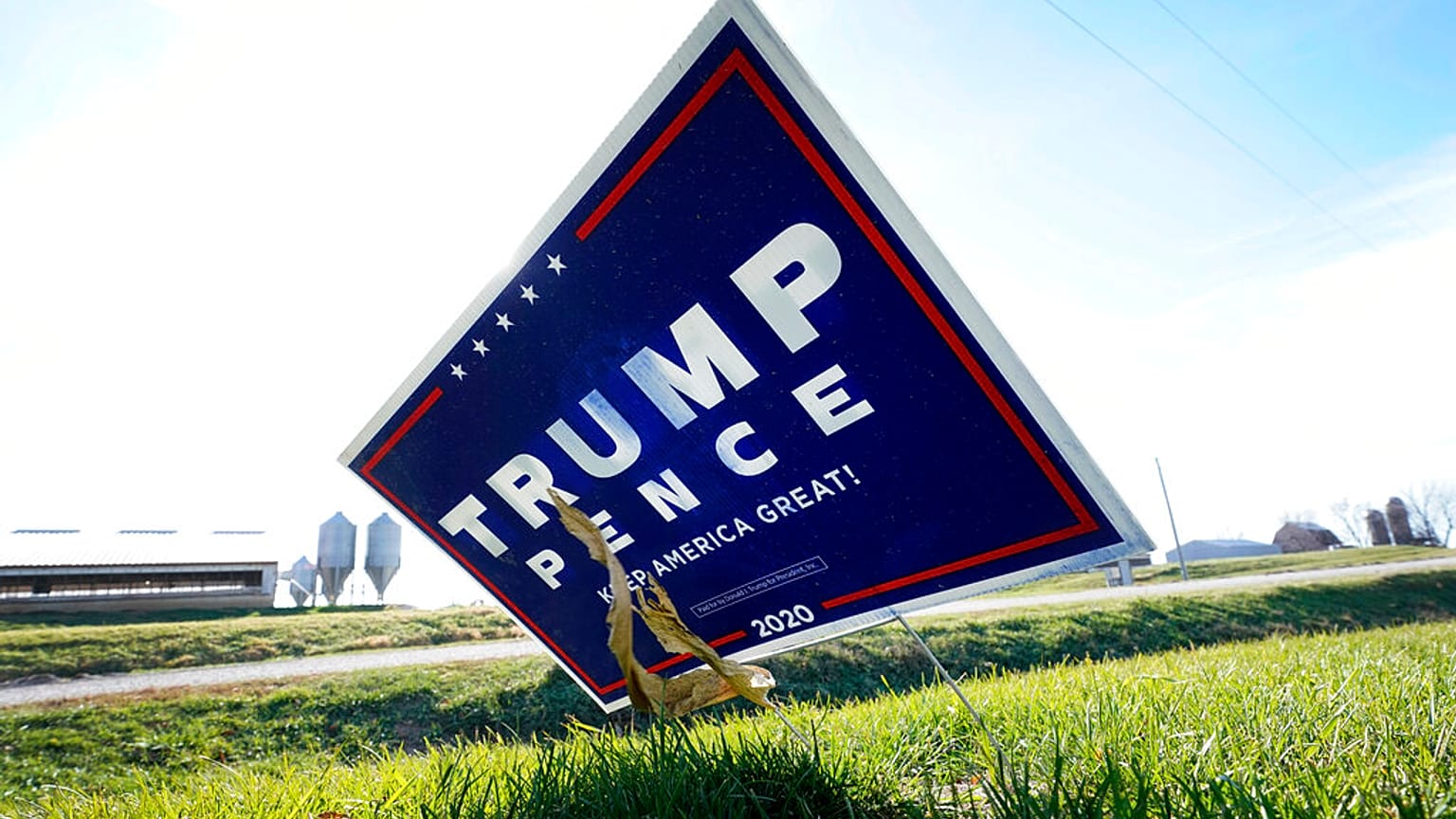 A sign in support of President Donald Trump is seen in the yard of Jasper County Republican Party chairman Thad Nearmyer, Thursday, Nov. 19, 2020, near Monroe, Iowa.