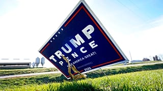 A sign in support of President Donald Trump is seen in the yard of Jasper County Republican Party chairman Thad Nearmyer, Thursday, Nov. 19, 2020, near Monroe, Iowa.