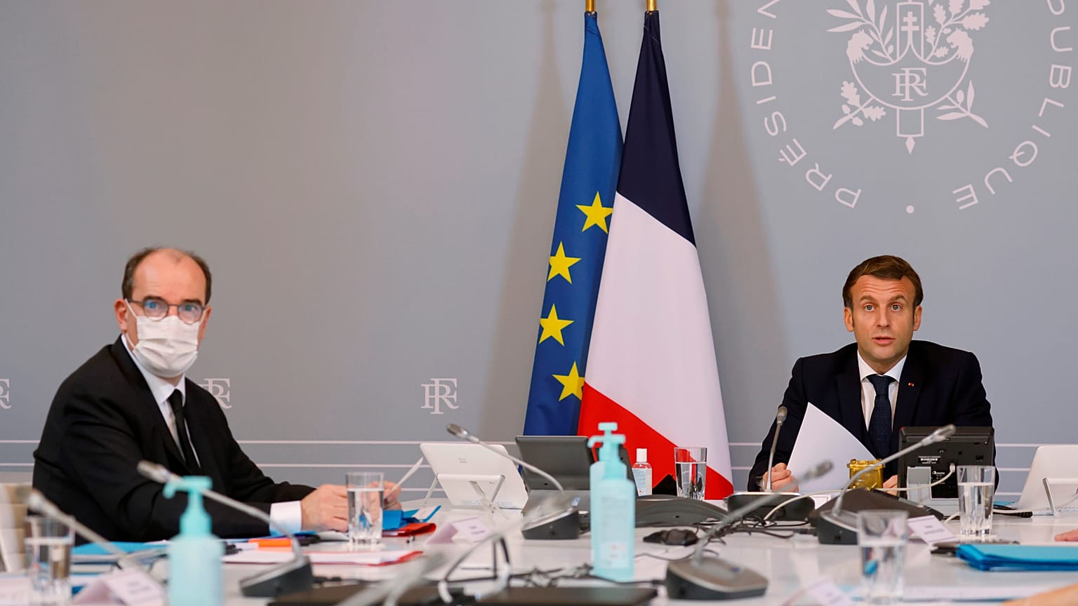 President Emmanuel Macron, right, speaks next to French Prime Minister Jean Castex, left, during a videoconference in Paris, November 17, 2020.