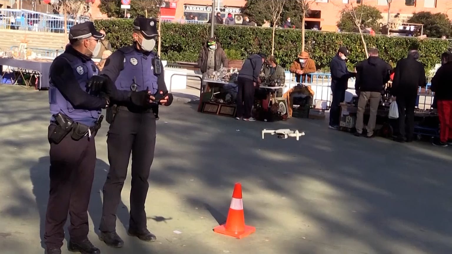 Police use drones as ancient Madrid market reopens
