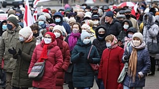 Belarusian pensioners attend an opposition rally to protest the official presidential election results in Minsk, Belarus, Monday, Nov. 23, 2020.