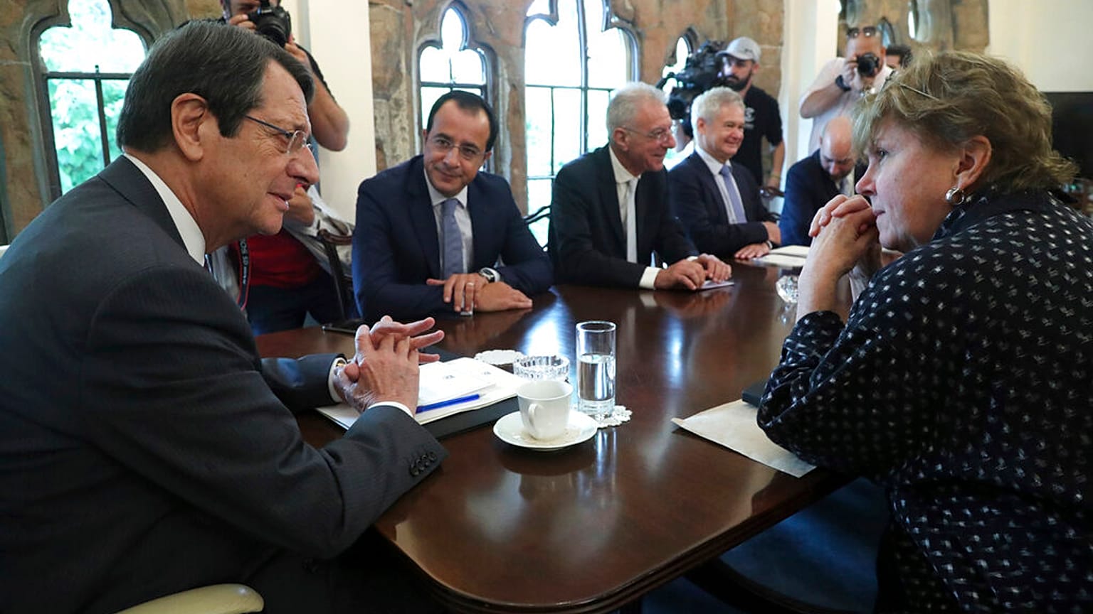 UN envoy Jane Holl Lute, right, talks with Cyprus' president Nikos Anastasiades