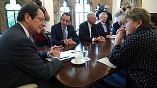 UN envoy Jane Holl Lute, right, talks with Cyprus' president Nikos Anastasiades
