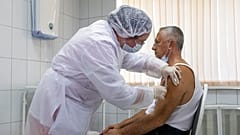 In this Sept. 15, 2020, file photo, a Russian medical worker administers a shot of Russia's experimental Sputnik V coronavirus vaccine in Moscow, Russia.
