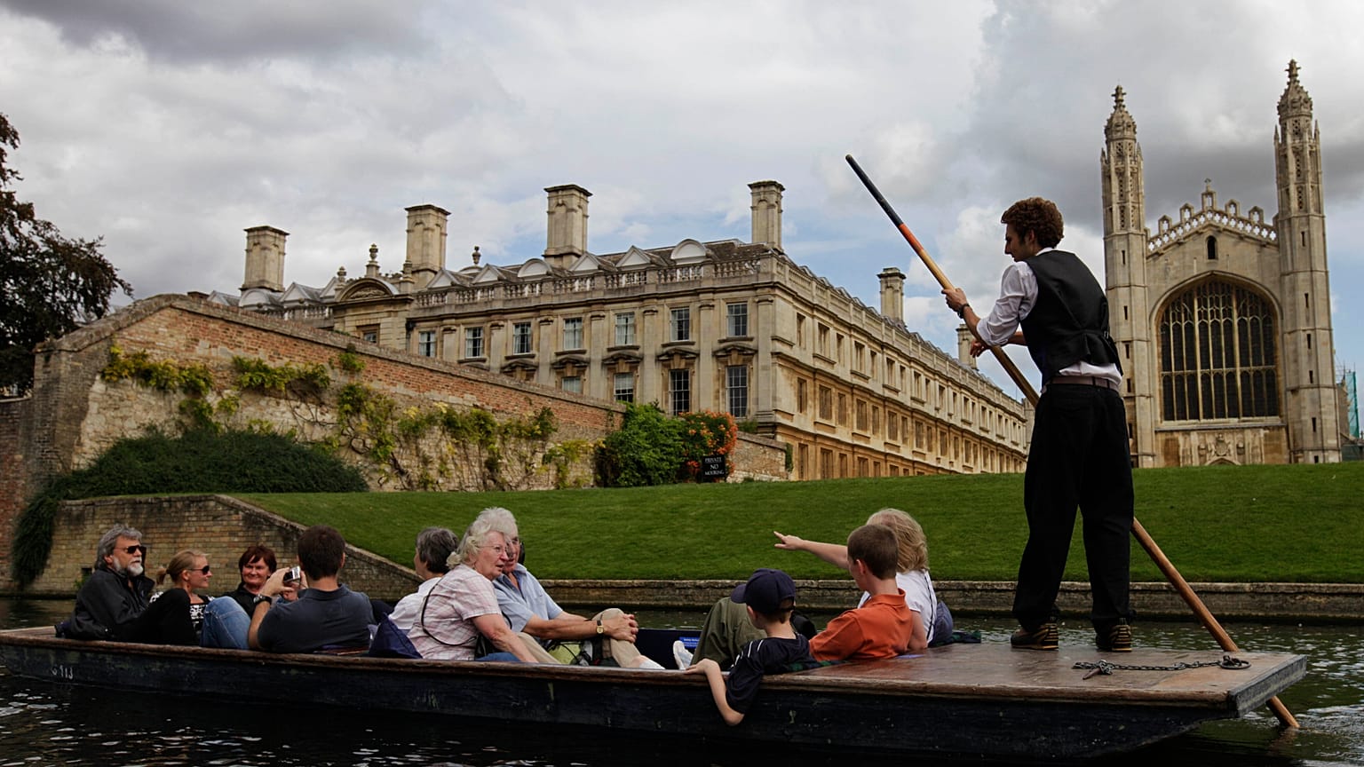 Tourists enjoy a punt on the river Cam, in Cambridge, England. 