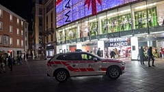 A police car in the area where a stabbing occurred in the department store, in Lugano, Switzerland, Tuesday, Nov. 24, 2020