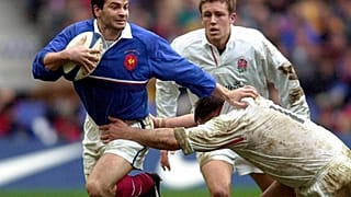 Le rugbyman français Christophe Dominici (à gauche) lors d'un match France-Angleterre le 19 février 2000 - photo d'archives