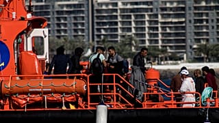 Spanish coastguards arrive in Arguineguin port carrying migrants after their rescue in Gran Canaria island, Spain on Wednesday Nov. 25, 2020.