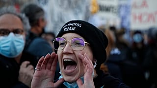 A protester shouts during a demonstration security law that would restrict sharing images of police, Saturday, Nov. 28, 2020 in Paris.