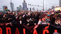 People demonstrate against police violence and an attempted restriction on abortion rights in Warsaw Poland, Saturday, Nov. 28, 2020