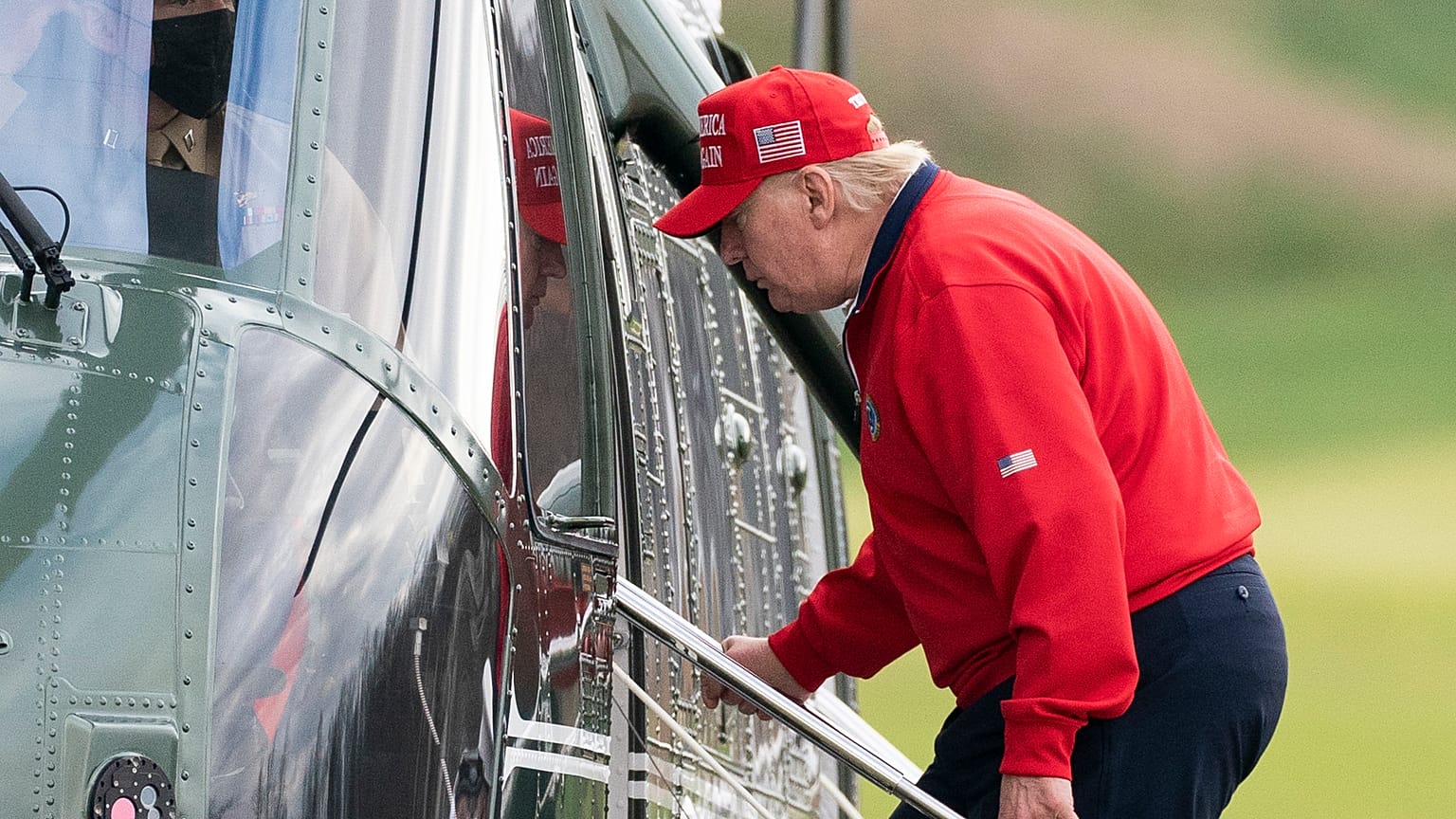 President Donald Trump boards Marine One after playing golf at Trump National Golf Club, Friday, Nov. 27, 2020, in Sterling, Va