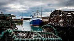  Jan. 28, 2020 photo, a fishing vessel is docked at Kilkeel harbor in Northern Ireland. 