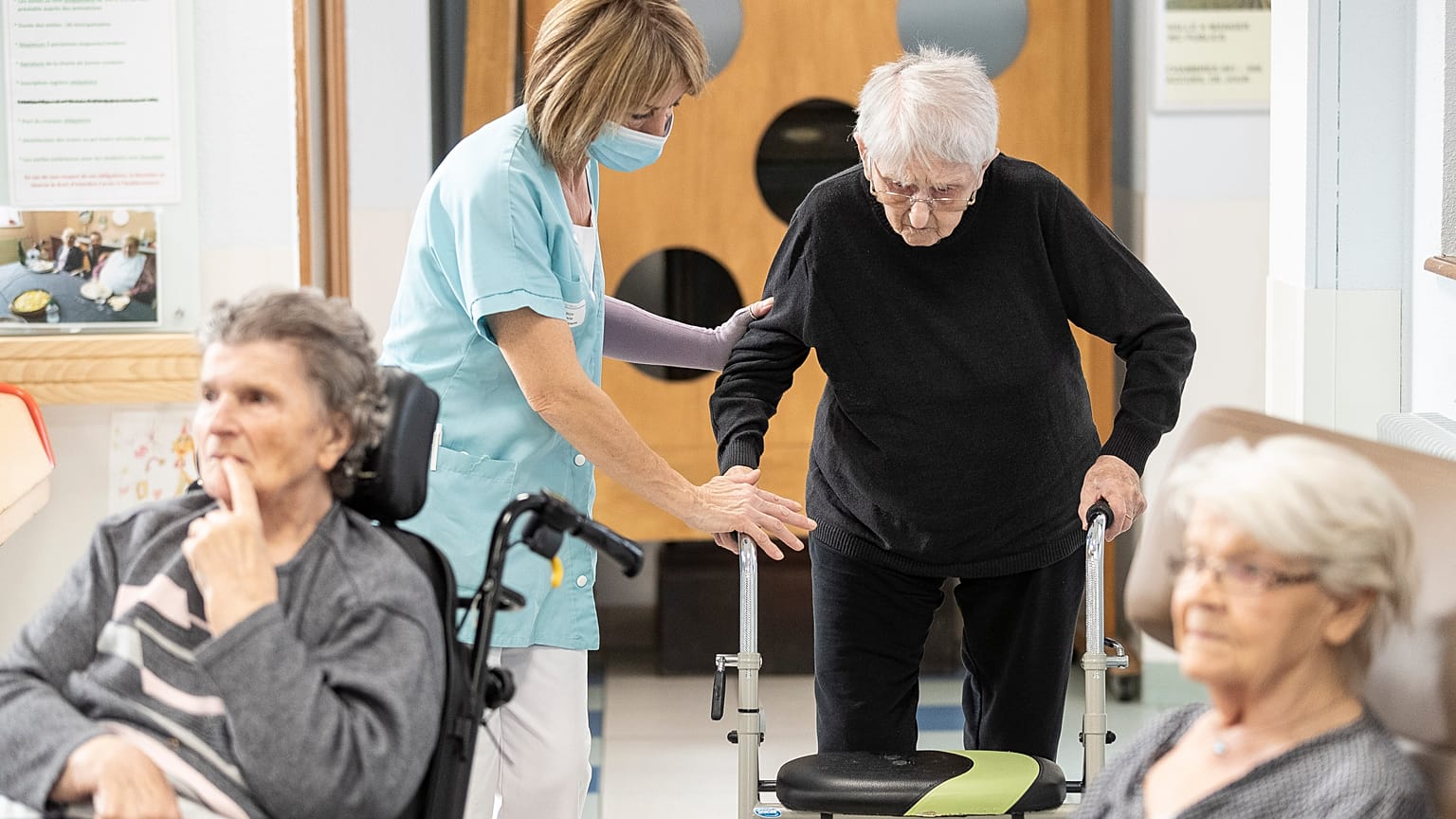 A man is helped before being tested with a PCR COVID test in a nursing home of Ammerschwihr, eastern France, Monday, Nov.9, 2020.