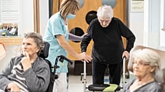 A man is helped before being tested with a PCR COVID test in a nursing home of Ammerschwihr, eastern France, Monday, Nov.9, 2020.