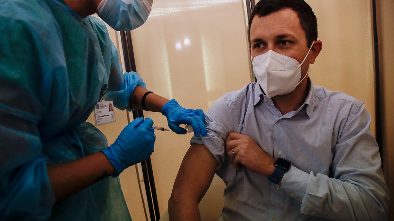People receives flu vaccine at the Museum of science and technology in Milan, Italy, Wednesday, Nov. 4, 2020.