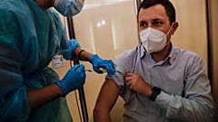People receives flu vaccine at the Museum of science and technology in Milan, Italy, Wednesday, Nov. 4, 2020.