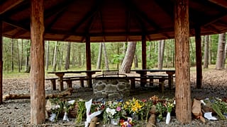 Flowers were left at the shelter where Phillip Mbuji Johansen was found on June 23 on the Danish island of Bornholm.