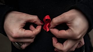 Red ribbons are the symbol of the fight against AIDS