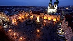 A Christmas tree illuminates the Old Town Square in Prague, Czech Republic, Saturday, Nov. 28, 2020. 