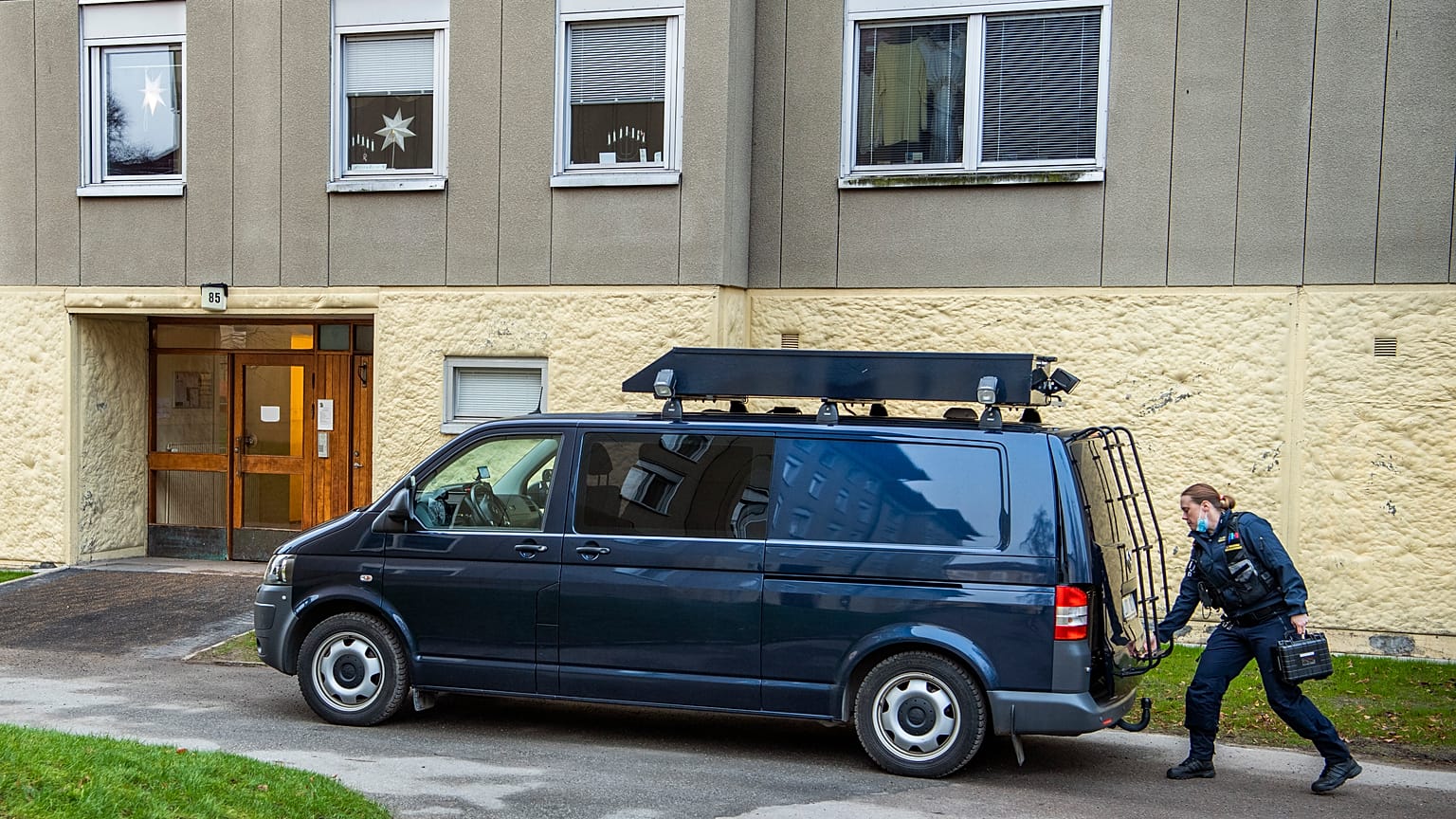 Police at the scene of an apartment where a woman is suspected of locking up her son, in Haninge