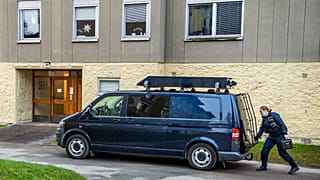 Police at the scene of an apartment where a woman is suspected of locking up her son, in Haninge