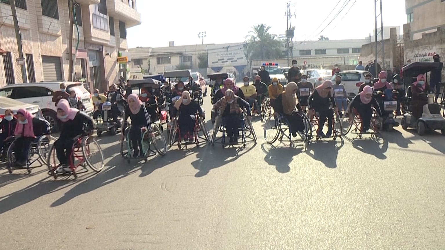 Palestinians with disabilities taking part in a marathon.