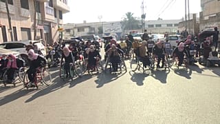 Palestinians with disabilities taking part in a marathon.