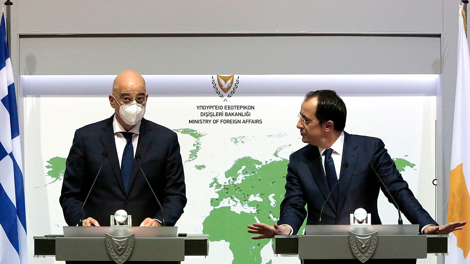 Greek Foreign Minister Nikos Dendias, left, and his Cyprus counterpart Nicos Christodoulides
