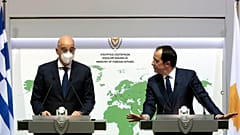 Greek Foreign Minister Nikos Dendias, left, and his Cyprus counterpart Nicos Christodoulides
