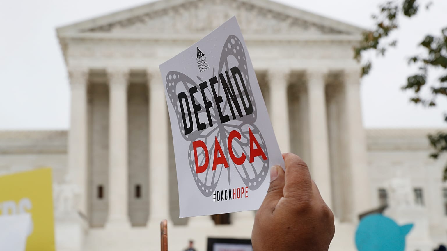 File photo: People rally outside the Supreme Court, Washington, as arguments are heard in the case of President Trump's decision to end DACA. Nov. 12, 2019.
