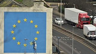 A mural by British artist Banksy, depicting a workman chipping away at one of the stars on an EU flag, is pictured in Dover, south east England on January 7, 2019.