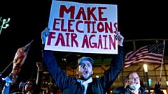 Jake Contos, a supporter of President Donald Trump, chants during a protest against the election results outside the central counting board at the TCF Center in Detroit.