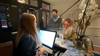 Clients at a reception desk in Madrid