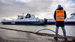 A man stand at the DFDS buffer zone before a press conference, as part of the Get Ready For Brexit campaign, at the DFDS ferry terminal at Rotterdam port, December 1, 2020.