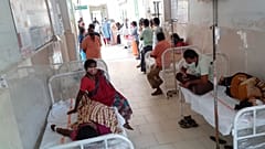 Patients and their bystanders are seen at the district government hospital in Eluru