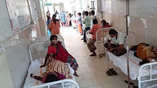 Patients and their bystanders are seen at the district government hospital in Eluru