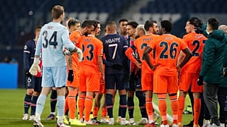 Players of Paris Saint Germain and Istanbul Basaksehir leave the pitch after an argument between the Turkish players and the fourth referee during a Champions League game.