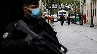 A French gendarme guards a street after a knife attack near the former offices of satirical newspaper Charlie Hebdo, Friday Sept. 25, 2020 in Paris.