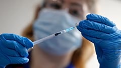 A nurse prepares a shot of the Pfizer-BioNTech COVID-19 vaccine at Guy's Hospital in London, Tuesday, Dec. 8, 2020.