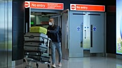 Passenger departing Heathrow airport, June 2020