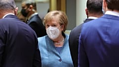 German Chancellor Angela Merkel, center, arrives for a round table meeting at an EU summit at the European Council building in Brussels, Thursday, Dec. 10, 2020. 