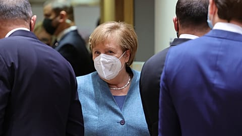 German Chancellor Angela Merkel, center, arrives for a round table meeting at an EU summit at the European Council building in Brussels, Thursday, Dec. 10, 2020. 