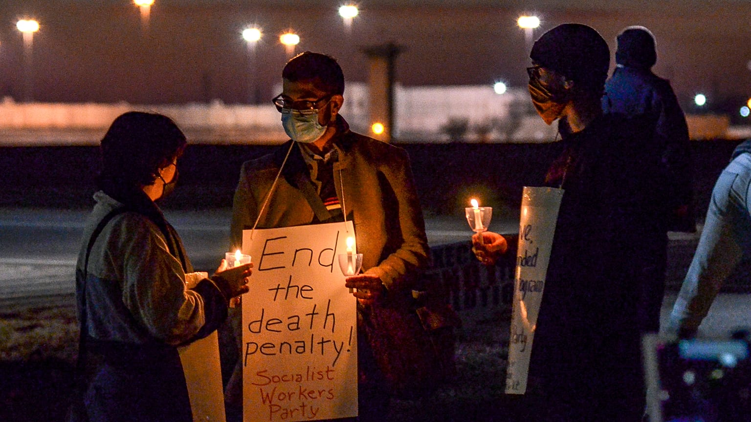 A protest against the execution of Brandon Bernard across Prairieton Road from the Federal Death Chamber in Terre Haute, Ind., on Thursday evening, Dec. 10, 2020. 