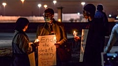 A protest against the execution of Brandon Bernard across Prairieton Road from the Federal Death Chamber in Terre Haute, Ind., on Thursday evening, Dec. 10, 2020. 