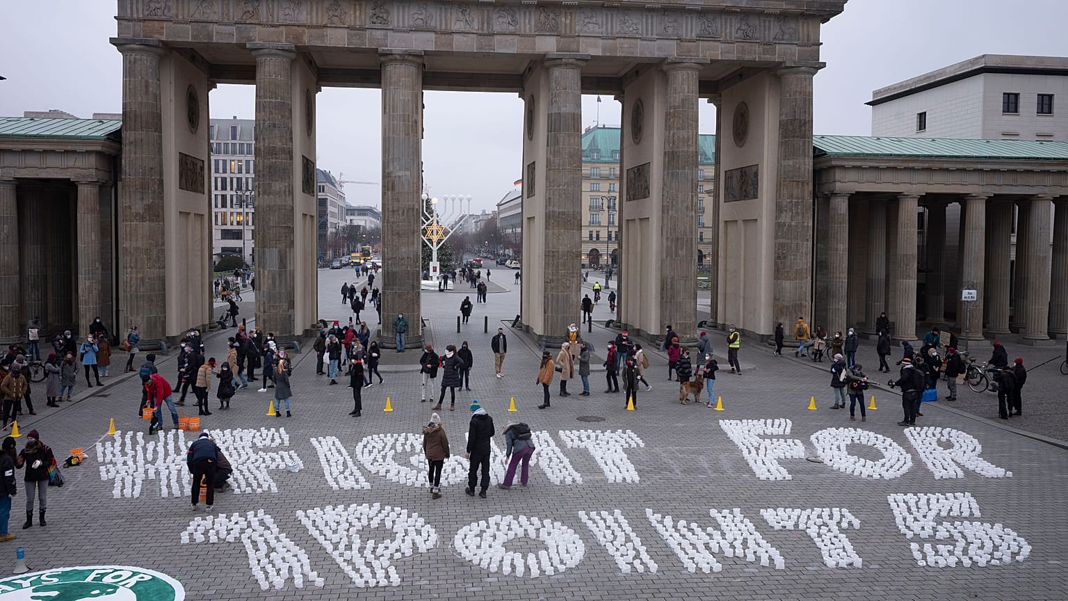 Students set up candles for the slogan'Fight for 1 point 5' during a protest of the Fridays For Future movement at the Brandenburg Gate Berlin, Germany