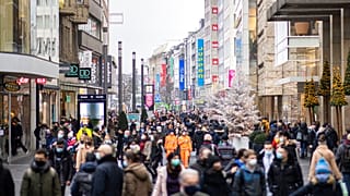 Numerous pedestrians walk through the decorated city centre in Duesseldorf, Germany, Saturday, Dec.12, 2020.