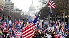 With the U.S. Capitol building in the background, supporters of President Donald Trump stand Pennsylvania Avenue during a rally at Freedom Plaza, Saturday, Dec. 12, 2020.